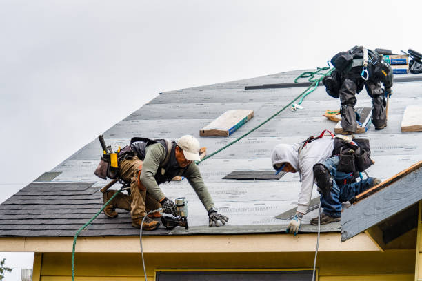 Professional Emergency Roof Repair technician working in Garden City, NY